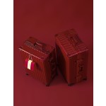 A pair of red leather wedding suitcases/dowry trunks for brides, featuring a combination lock.